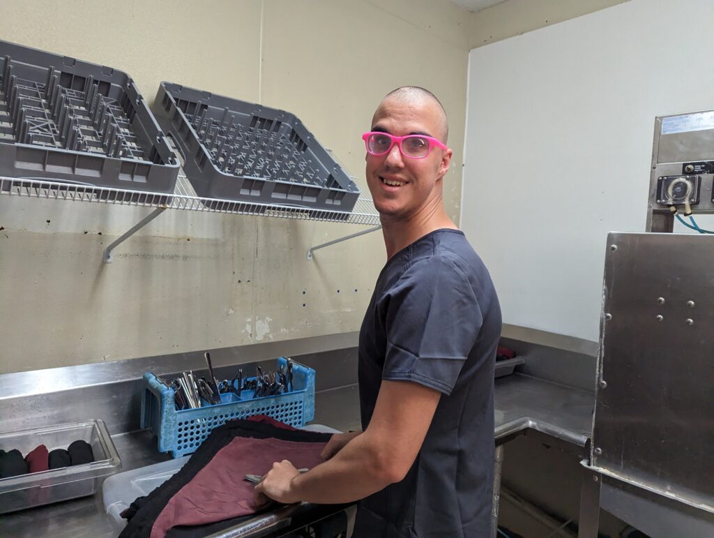 Raven washes dishes at his new job at Rolling Hills Healthcare.
